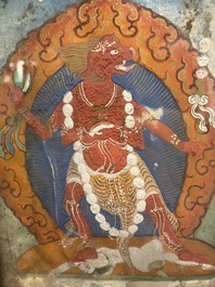 Een Tibetaanse thangka in ingelegde vergulde koperen lijst, 19e eeuw